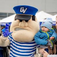 Louie poses with a Laker family